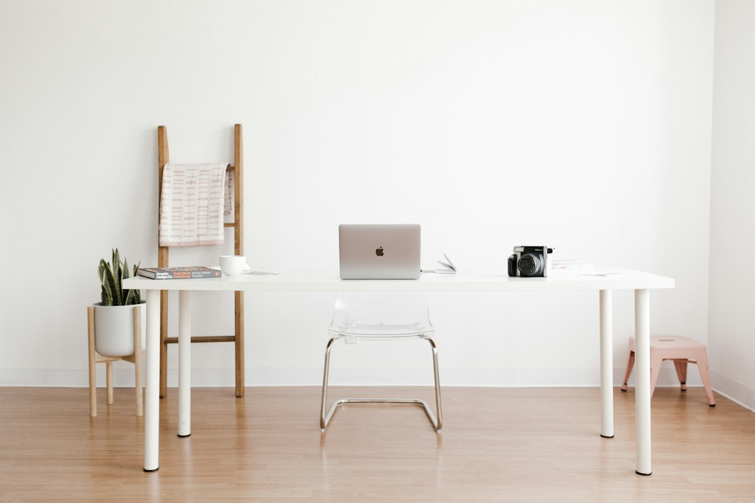Modern desk workspace with a laptop showcasing e-commerce platform analytics and planning tools.