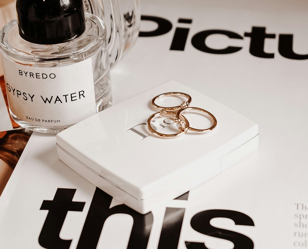 A structured logo design brief document sitting on a creative workspace alongside color swatches and design sketches.